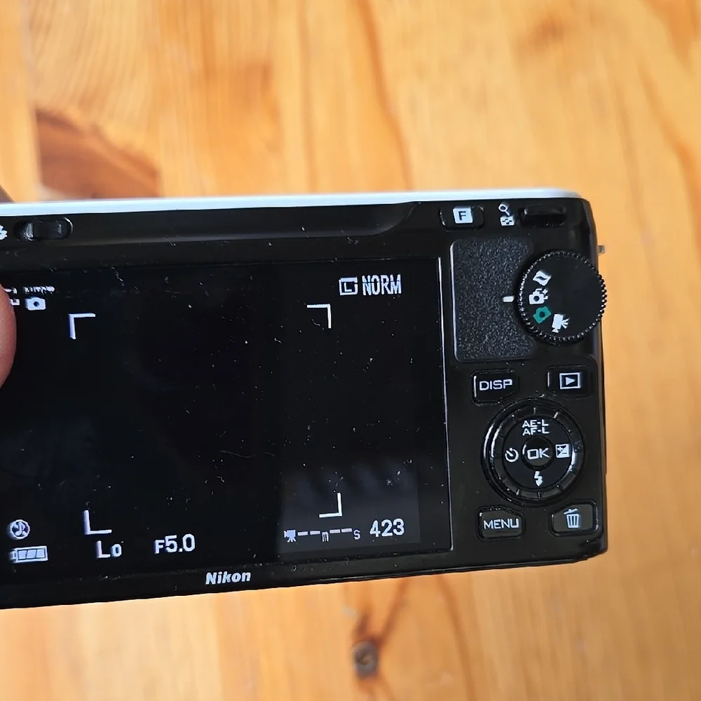 Compact Silver Camera with Accessories